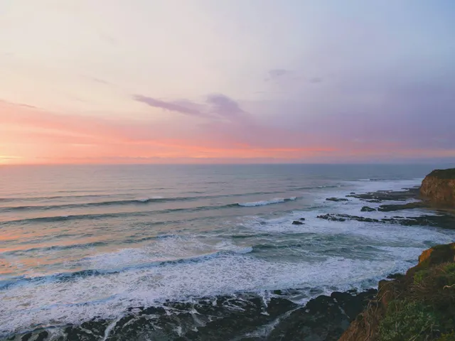 sea beside rock formation during golden hour jigsaw puzzle