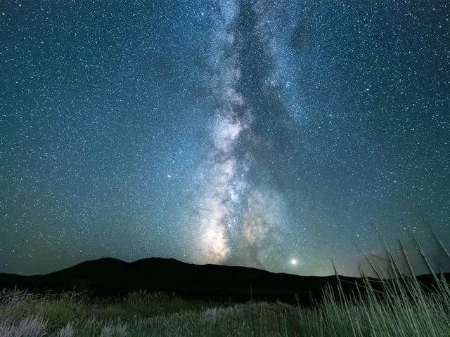 starry sky over mountains and grass jigsaw puzzle