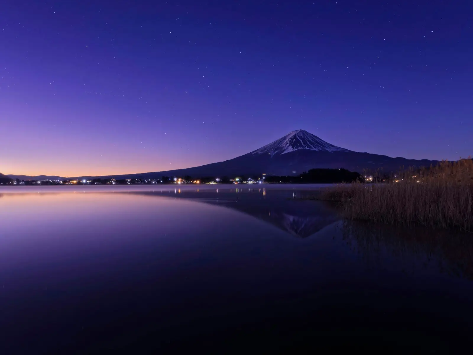 a night scene of a lake with a mountain in the background jigsaw puzzle
