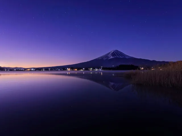 a night scene of a lake with a mountain in the background jigsaw puzzle