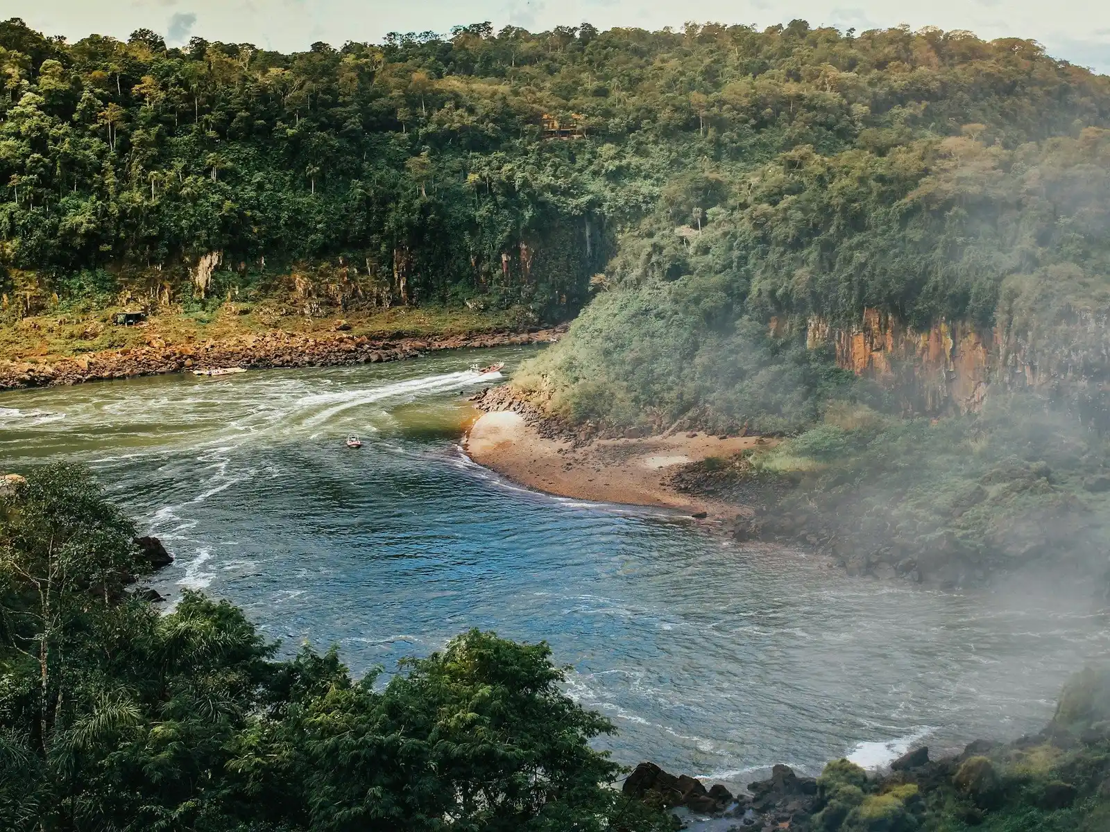 river between green trees during daytime jigsaw puzzle