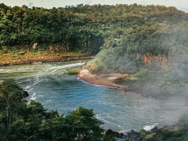 river between green trees during daytime jigsaw puzzle